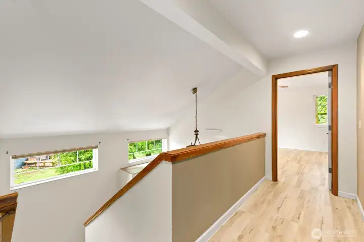 Hallway that leads into primary bedroom.