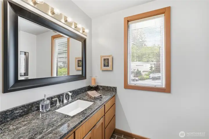 Spacious guest half bath with an additional storage closet. Spacious guest half bath with an additional storage closet.