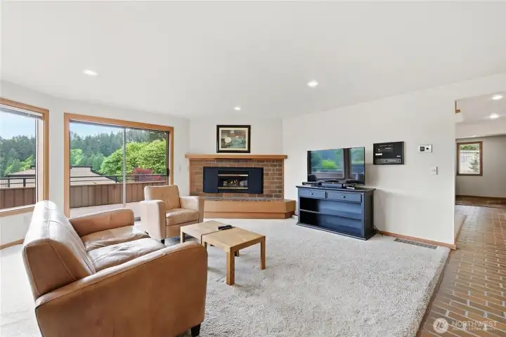 The family room features a cozy gas fireplace and abundant natural light. The family room features a cozy gas fireplace and abundant natural light.