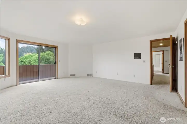 View from the primary bedroom toward the open loft space. View from the primary bedroom toward the open loft space.