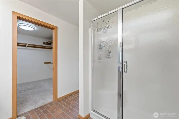 Primary bathroom featuring a walk-in shower. Primary bathroom featuring a walk-in shower.