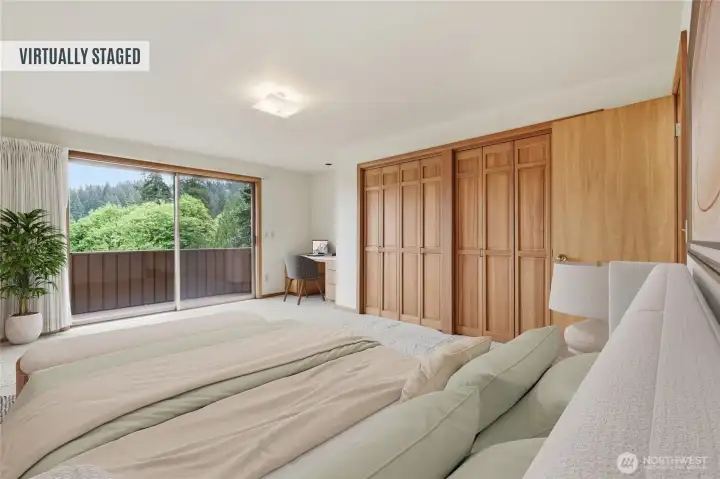 Large bedroom featuring a private balcony, built-in desk, dual-access bathroom, and two spacious closets. Large bedroom featuring a private balcony, built-in desk, dual-access bathroom, and two spacious closets.