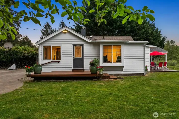 Welcoming entry to the refreshed three bedroom waterfront residence. Thoughtfully refreshed.