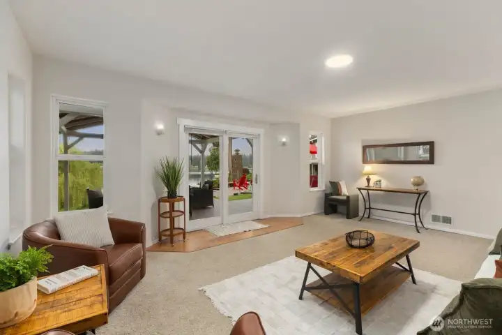 Spacious gathering areas with lake views, and seamless indoor outdoor flow.