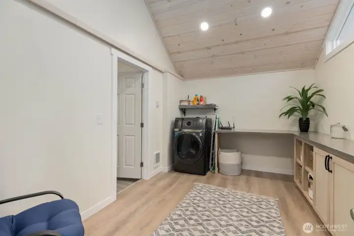 Flexible, bonus room in the ADU with washer/dryer, built-in storage and workspace potential