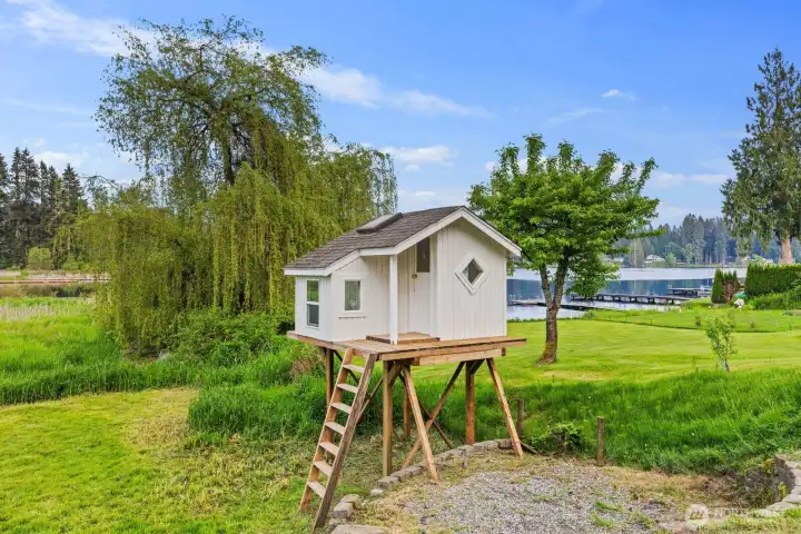 Waterfront living meets childhood dreams with a private treehouse overlooking beautiful cottage lake