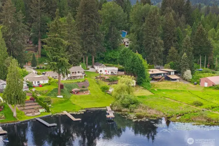 Incredible aerial perspective captures the scale, privacy, and beauty of this one of a kind lakefront property