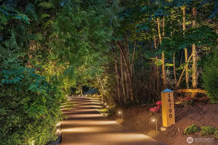 An enchanting private drive, gated at the top.