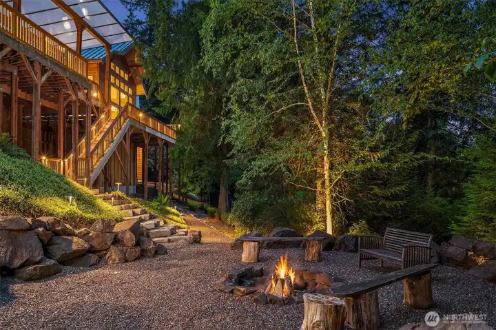 Wood-burning fire pit & beautiful trails surround the lower lawn.