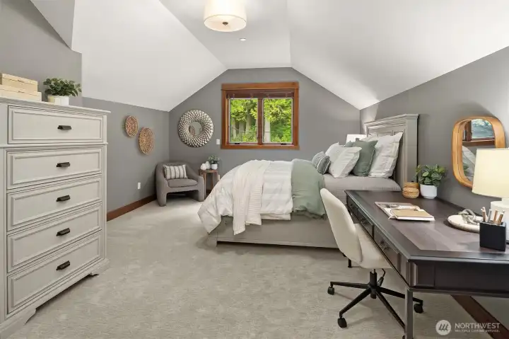 MIL bedroom, with walk-in closet & ample storage. Full bath.