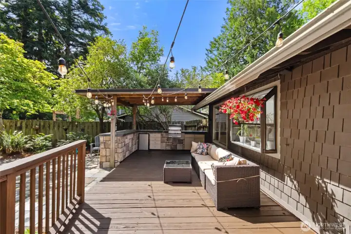This backyard is the real showstopper! Enjoy the expansive deck, outdoor kitchen, multiple patio spaces, batting cage, hot tub and lush manicured greens! This backyard is the real showstopper! Enjoy the expansive deck, outdoor kitchen, multiple patio spaces, batting cage, hot tub and lush manicured greens!