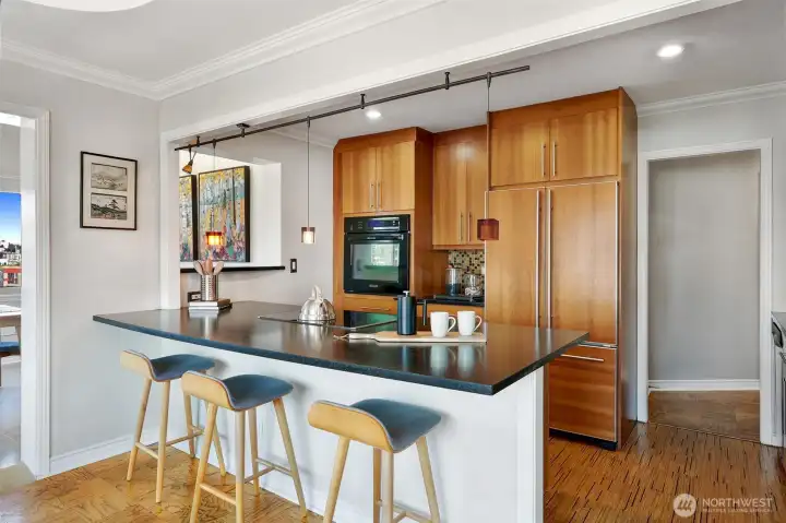 Beautifully updated kitchen with custom cabinets & lots of counter space.