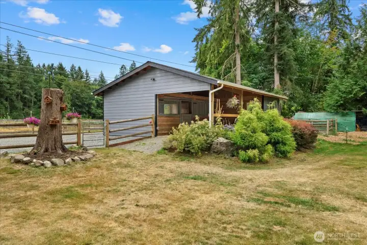 Everything you need for your equestrian lifestyle—secure tack room, roomy barn, fenced pastures, and 12 x 24 loafing shed behind the barn. Everything you need for your equestrian lifestyle—secure tack room, roomy barn, fenced pastures, and 12 x 24 loafing shed behind the barn.