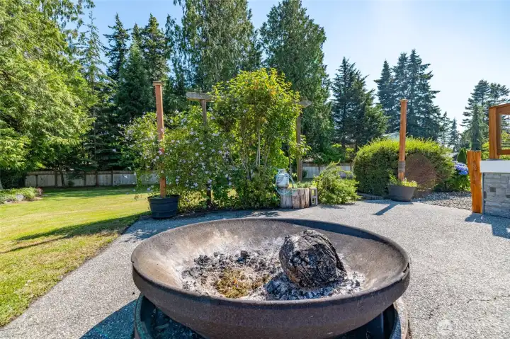 With a large patio and fire pit. With a large patio and fire pit.