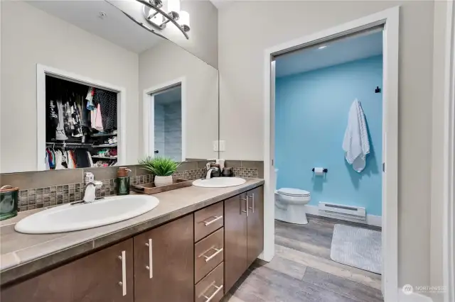 Primary bath with double sinks and custom 5 foot alk-in shower.