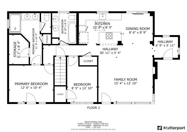 The main floor offers a well-appointed kitchen, dining room, family room, and three additional bedrooms. A primary suite with an en-suite bathroom and storage space completes the layout.