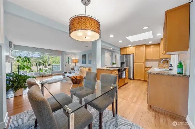 An open-concept design connects the dining area, kitchen, and living room, creating a seamless flow for everyday entertaining.