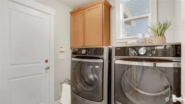 Utility room on the main floor with direct access to the garage