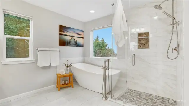 A deep soaking tub, beautiful shower, and toasty heated floors makes this bathroom a spa retreat