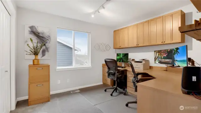 This upstairs guest bedroom has been used as a fully functional office area