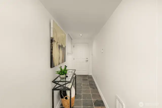 Tiled-Unit's front entry door and hallway.