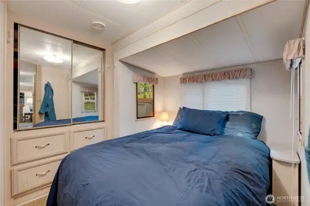 Bedroom with built in closet and dresser