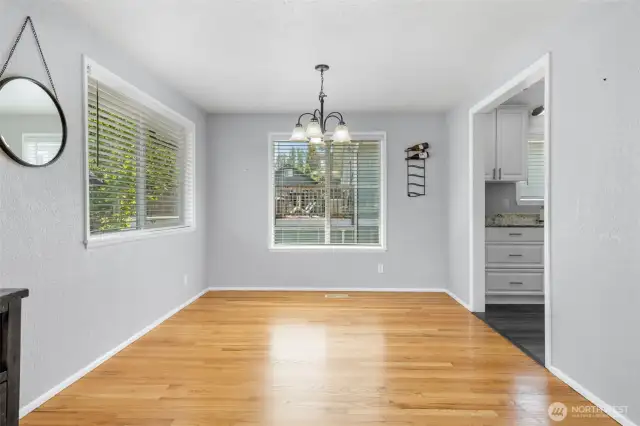 Formal dining room with large windows proving an abundance of natural light.