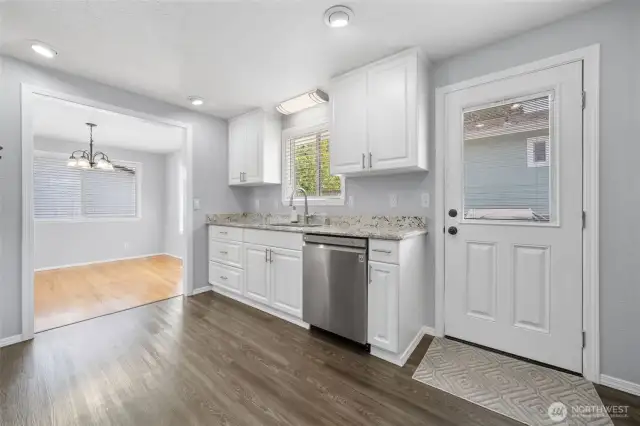 Spacious kitchen with door out to the side deck.