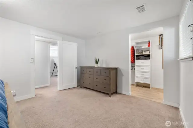 Primary bedroom with walk-in closet.