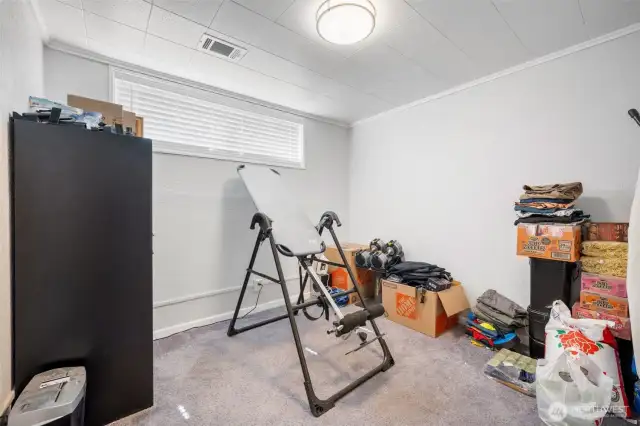 Bedroom on the lower level. Pardon our mess we are in the middle of moving.