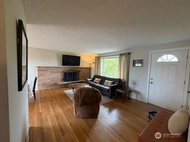 Lovely oak floors and big west side window in the living room