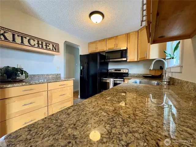 Walk through kitchen, large country sink and stainless appliances