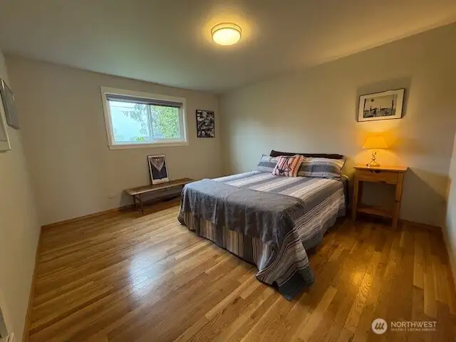 Pretty floors and views from this bedroom.  Built ins too.