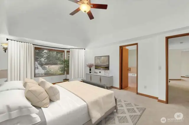 Spacious primary suite with bay windows.