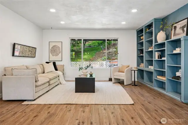 Living room with natural light and a view of the back yard