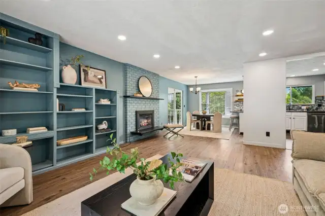 Living room with cozy fireplace and dining room