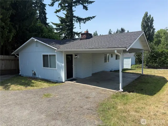 Large attached carport with great parking area