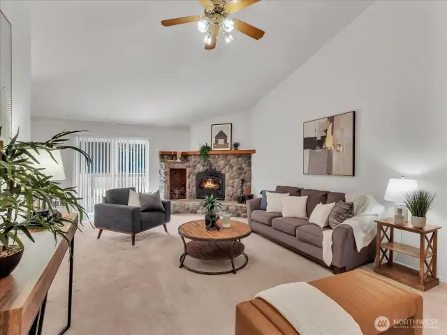 Large living room with wood-burning fireplace.