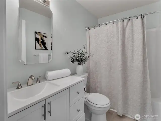 Third bathroom downstairs next to bedrooms.