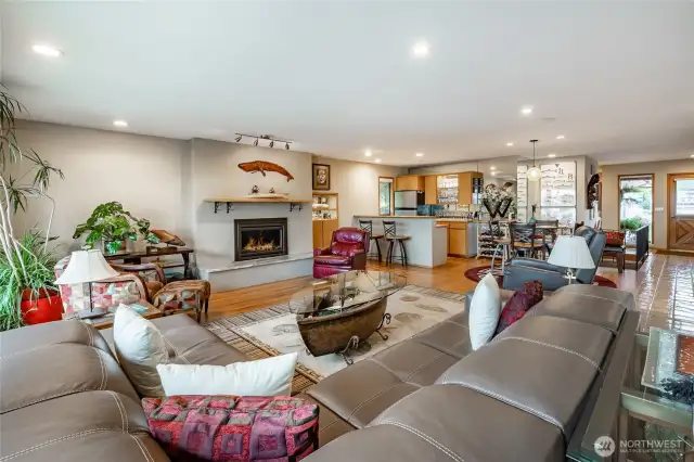 Great room has classic Oak Hardwood floors, incredible views, multi speed natural gas fireplace and bar area