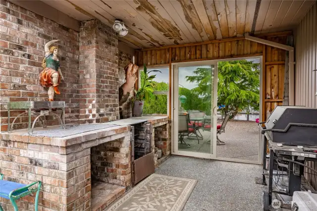 Exterior Barbeque room. The home has cedar siding and the next owner will get to pick their own colors as it will need painting.