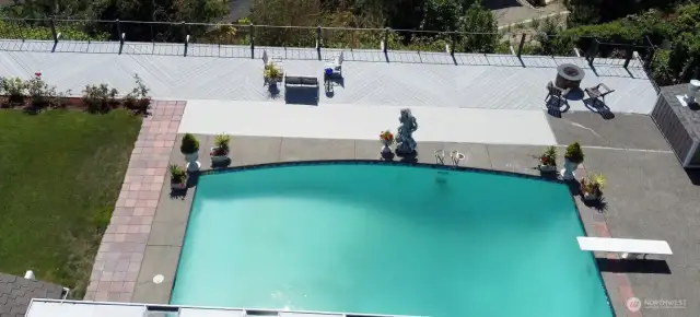Host a dream party with your in-ground pool, grass lawn, expansive deck, and covered patio