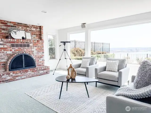 The main living room has an open floor plan, French doors leading to the patio, and a cozy fireplace