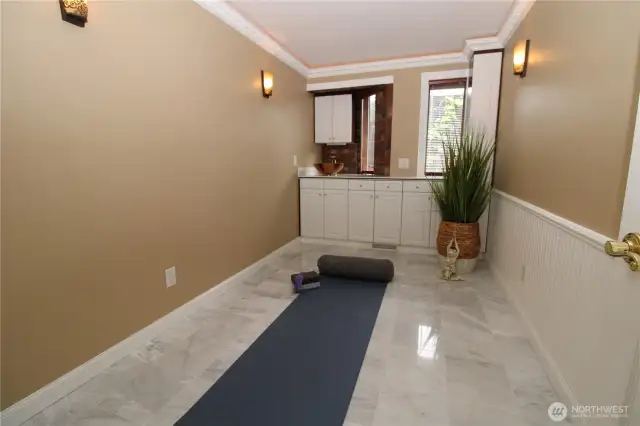 Imagine the potential with two incredible flex rooms, each with built-in cabinetry and individual sinks - perfect for home offices, a craft room, exercising, or whatever your heart desires