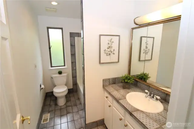 You'll appreciate the convenience of a private primary bathroom with all the essentials - sink, shower, bathtub, and toilet