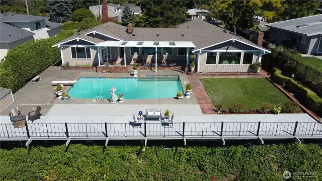 The covered patio is a wonderful space to enjoy the view, out of the sun or rain