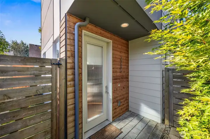 Private, tree covered entrance.