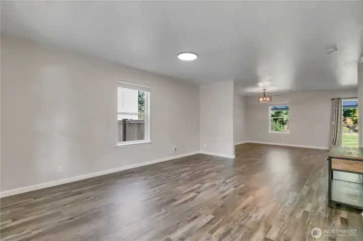 Welcome in! The family and dining rooms create a warm, open layout, complete with vinyl plank flooring.