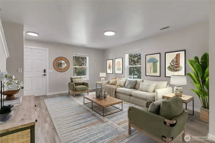 Plenty of room to arrange your furniture and make the family room your own. Image is virtually staged.