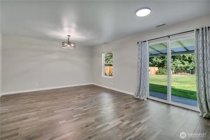 Step from the dining area right onto the covered back patio—perfect for seamless indoor-outdoor living.